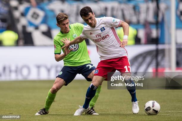 Sebastian Jung of Wolfsburg and Filip Kostic of Hamburg battle for the ball during the Bundesliga match between Hamburger SV and VfL Wolfsburg at...