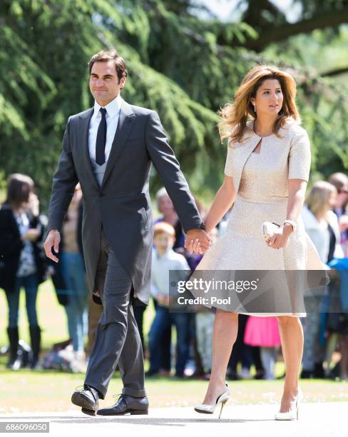 Roger Federer and Mirka Federer attend the wedding Of Pippa Middleton and James Matthews at St Mark's Church on May 20, 2017 in Englefield Green,...