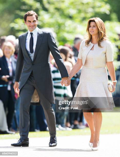 Roger Federer and Mirka Federer attend the wedding Of Pippa Middleton and James Matthews at St Mark's Church on May 20, 2017 in Englefield Green,...