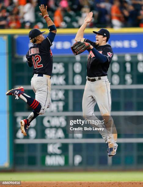 Francisco Lindor of the Cleveland Indians high fives Bradley Zimmer after the final out as the Cleveland Indians defeated the Houston Astros 3-0 at...