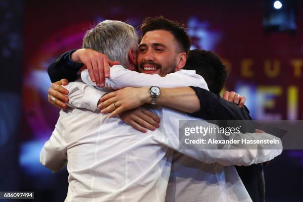 Head coach Carlo Ancelotti is hugged by his son Davide Ancelotti during the FC Bayern Muenchen Championship party following the Bundesliga match...