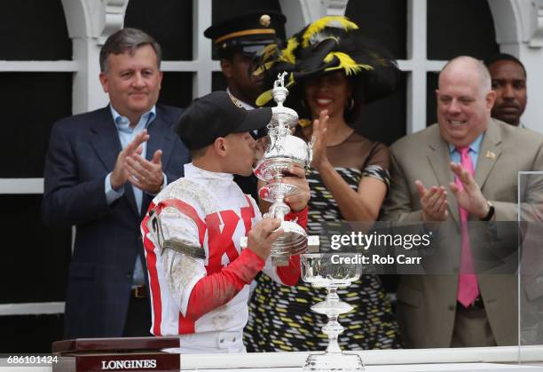 Javier Castellano rider of Cloud Computing celebrates with the trophy alongside Baltimore City Stephanie Rawlings-Blake and Maryland Governor Larry...