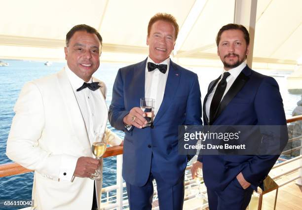 Pascal Borno, Arnold Schwarzenegger, and Michele Malenotti attend the Vanity Fair and HBO Dinner celebrating the Cannes Film Festival at Hotel du...