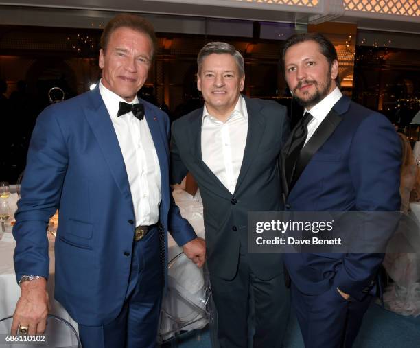 Arnold Schwarzenegger, Ted Sarandos, and Michele Malenotti attend the Vanity Fair and HBO Dinner celebrating the Cannes Film Festival at Hotel du...
