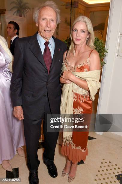 Clint Eastwood and Christina Sandera attend the Vanity Fair and HBO Dinner celebrating the Cannes Film Festival at Hotel du Cap-Eden-Roc on May 20,...