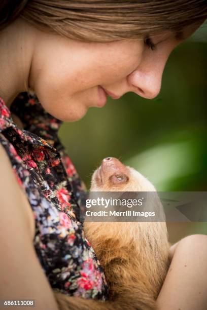 Costa Rica, Tourist with baby sloth.