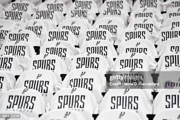 Shirts are placed on the seats for fans before the game between the San Antonio Spurs and the Golden State Warriors during Game Three of the Western...