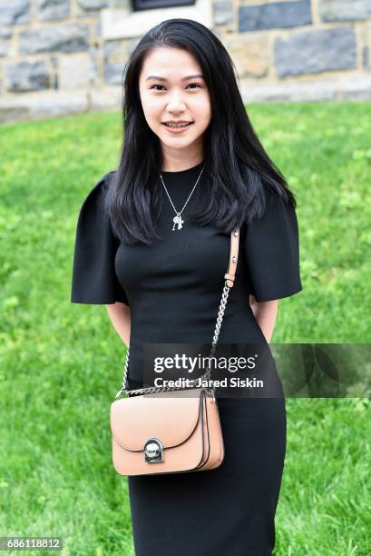 Nadya Lumanpauw is seen accesorizing a prada bag at Filbert Nickolas's Graduation at Fordham University on May 20, 2017 in Bronx, New York.