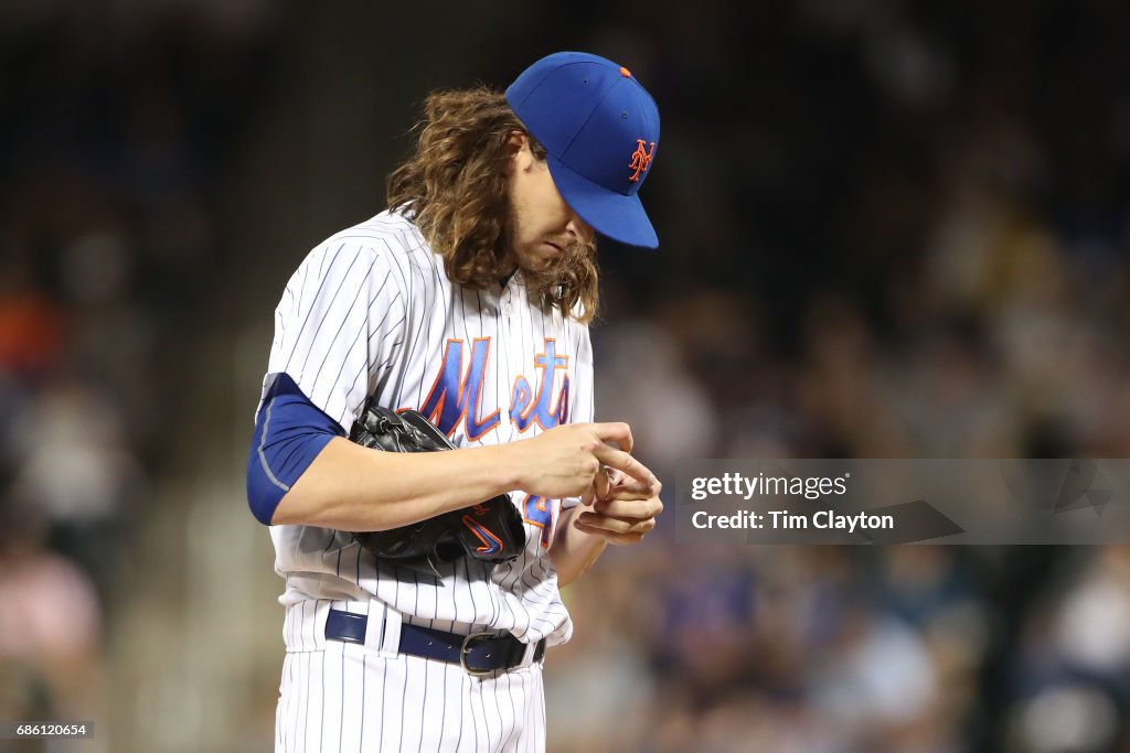 Mets Rattle Pitcher Jacob deGrom of the New York Mets checks a blister while ...