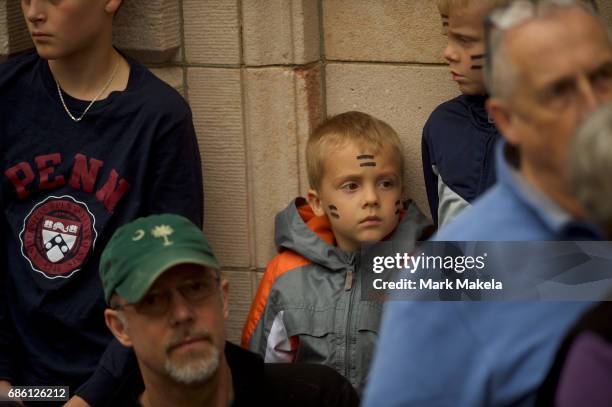 Boy wears equals sign face paint joining demonstrators at a counter protest rally, organized by the NAACP, in response of a planned Klu Klux Klan...