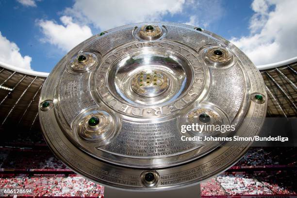 The championship trophy is displayed prior to the Bundesliga match between Bayern Muenchen and SC Freiburg at Allianz Arena on May 20, 2017 in...