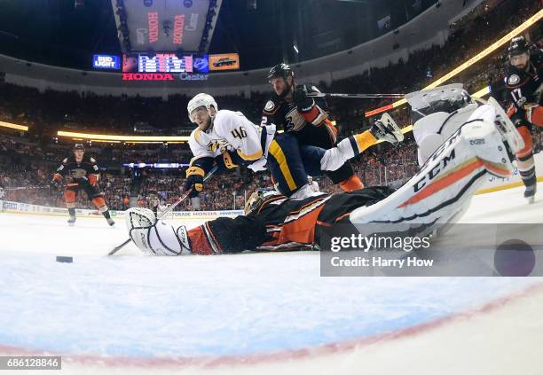 Pontus Aberg of the Nashville Predators scores a goal as he falls to the ice against goaltender Jonathan Bernier of the Anaheim Ducks in the third...