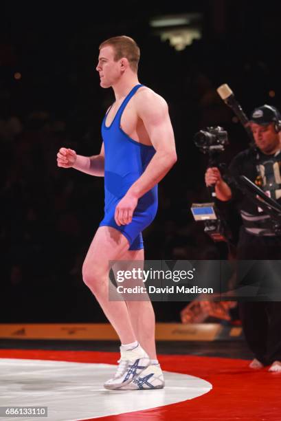 Cael Sanderson of the United States enters the ring before wrestling Yoel Romero of Cuba during the freestyle wrestling event of the Titan Games on...