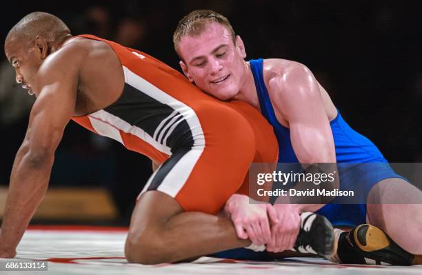 Cael Sanderson of the United States wrestles Yoel Romero of Cuba during the freestyle wrestling event of the Titan Games on February 14, 2003 at the...