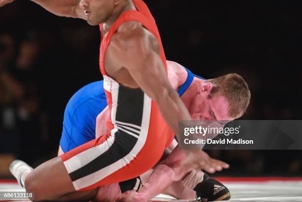 Cael Sanderson of the United States wrestles Yoel Romero of Cuba during the freestyle wrestling event of the Titan Games on February 14, 2003 at the...