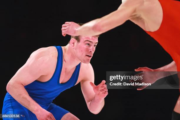 Cael Sanderson of the United States wrestles Semen Semenok of Belarus during the freestyle wrestling event of the Titan Games on February 15, 2003 at...