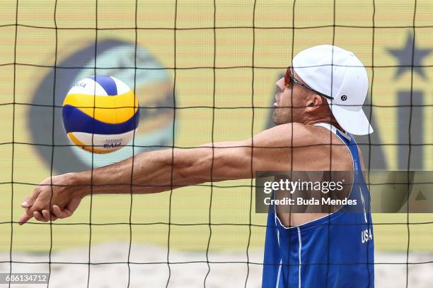 Jacob Gibb of the United States in action during the Men's Round of 03 match against Alison Cerutti and Bruno Schmidt of Brazil at Olympic Park...