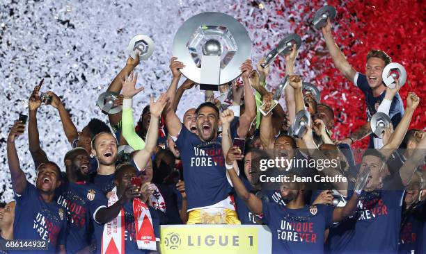 Radamel Falcao of Monaco holds the trophy during the French League 1 Championship title celebration following the French Ligue 1 match between AS...