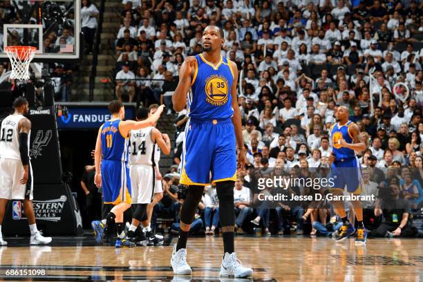 Kevin Durant of the Golden State Warriors reacts during the game against the San Antonio Spurs during Game Three of the Western Conference Finals of...