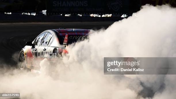 Shane Van Gisbergen drives the Red Bull Holden Racing Team Holden Commodore VF celebrates after winning race 10 for the Winton SuperSprint, which is...