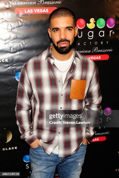 Recording artist Drake arrives at Sugar Factory American Brasserie at the Fashion Show mall to debut his signature Night Owl goblet for his Virginia...