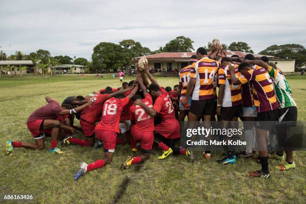Both teams pause for rayer before kick-off in the Fiji National Rugby League western conference Nadroga zone Premier competition match between the...
