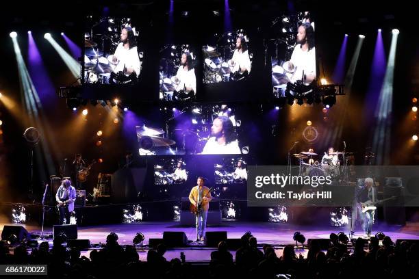 Matthew Followill, Caleb Followill, Nathan Followill, and Jared Followill of Kings of Leon perform at PNC Bank Arts Center on May 20, 2017 in...