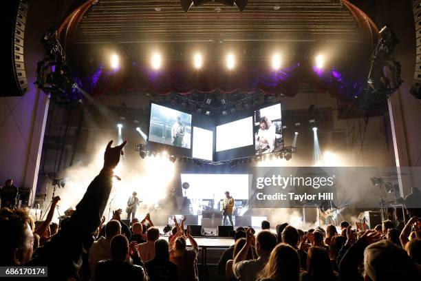 Matthew Followill, Caleb Followill, Nathan Followill, and Jared Followill of Kings of Leon performs at PNC Bank Arts Center on May 20, 2017 in...