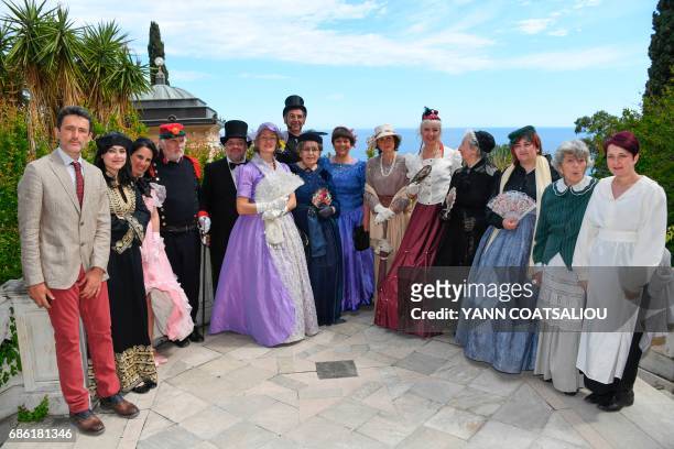 Garden president Luigi Minuto poses with actors reenacting everyday life in the Hanbury Gardens in collaboration with the Cultural Association...