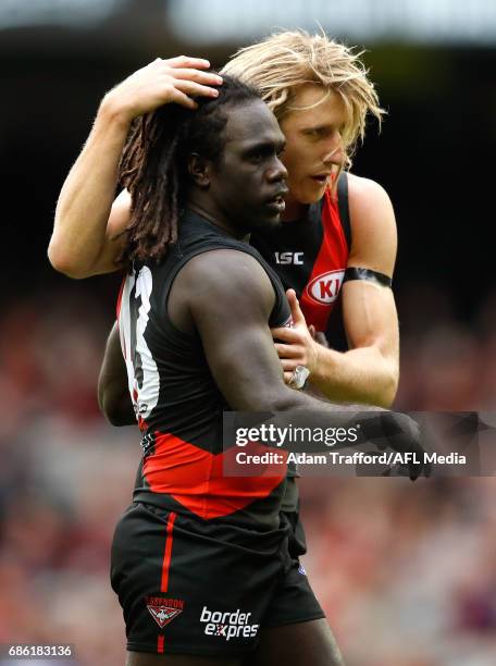 Dyson Heppell of the Bombers congratulates Anthony McDonald-Tipungwuti of the Bombers on a goal during the 2017 AFL round 09 match between the...