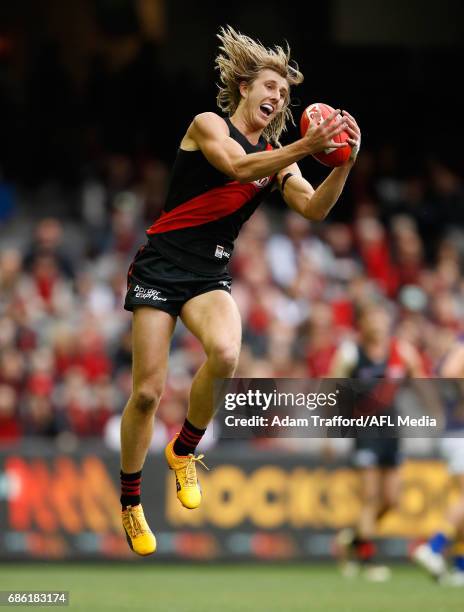 Dyson Heppell of the Bombers marks the ball during the 2017 AFL round 09 match between the Essendon Bombers and the West Coast Eagles at Etihad...