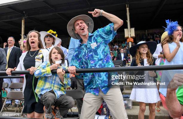 The Owczarcak family Karen, Harrison and Ray celebrate winning the tenth race by betting the 10 horse Cambodia with jockey Florent Geroux during the...
