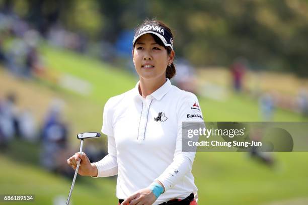 Mami Fukuda of Japan reacts after a putt on the 18th green during the final round of the Chukyo Television Bridgestone Ladies Open at the Chukyo Golf...