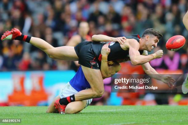 Jack Redden of the Eagles tackles David Myers of the Bombers during the round nine AFL match between the Essendon Bombers and the West Coast Eagles...