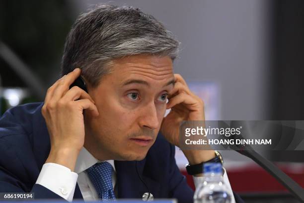 Canada's International Trade Minister Francois-Philippe Champagne listens to a question during a joint press conference held on the sidelines of the...