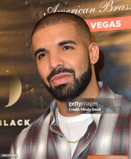 Recording artist Drake arrives at Sugar Factory American Brasserie at the Fashion Show mall to debut his signature Night Owl goblet for his Virginia...