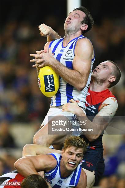 Todd Goldstein of the Kangaroos marks infront of Tom McDonald of the Demons during the round nine AFL match between the Melbourne Demons and the...