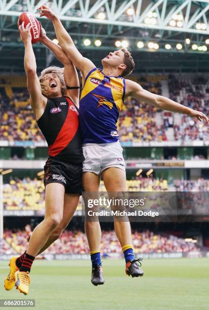 Dyson Heppell of the Bombers marks the ball against Jack Redden of the Eagles during the round nine AFL match between the Essendon Bombers and the...