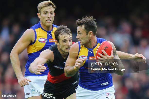 Jobe Watson of the Bombers tackles Chris Masten of the Eagles during the round nine AFL match between the Essendon Bombers and the West Coast Eagles...