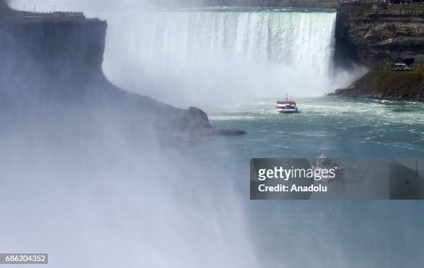 Long boat which carries the visitors are seen on Niagara Fall near Ontario River, in Canada, North America on May 08, 2017. Niagara Falls is one of...