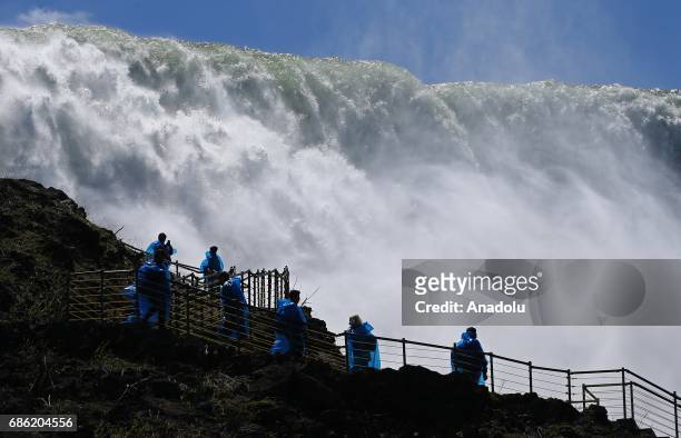 Visitors are seen on an observing tower's ladder to watch the Niagara Fall near Ontario River, in Canada, North America on May 08, 2017. Niagara...