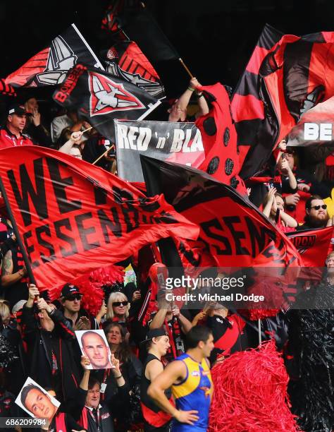 Bombers fans celebrate a goal during the round nine AFL match between the Essendon Bombers and the West Coast Eagles at Etihad Stadium on May 21,...