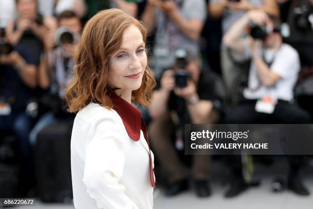 French actress Isabelle Huppert poses on May 21, 2017 during a photocall for the film 'Claire's Camera ' at the 70th edition of the Cannes Film...