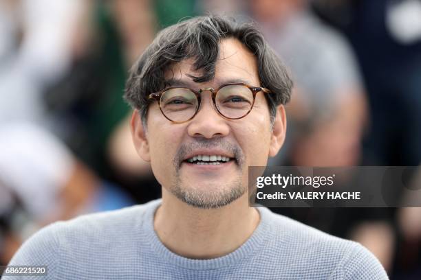 South Korean actor Jeong Jin-young poses on May 21, 2017 during a photocall for the film 'Claire's Camera ' at the 70th edition of the Cannes Film...