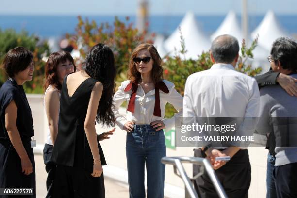 South Korean actress Kim Min-hee and French actress Isabelle Huppert arrive on May 21, 2017 to attend a photocall for the film 'Claire's Camera ' at...