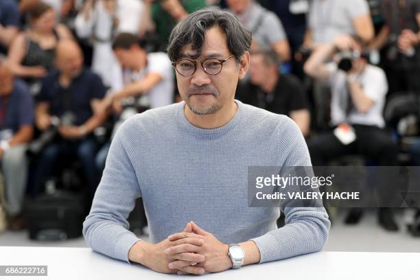 South Korean actor Jeong Jin-young poses on May 21, 2017 during a photocall for the film 'Claire's Camera ' at the 70th edition of the Cannes Film...