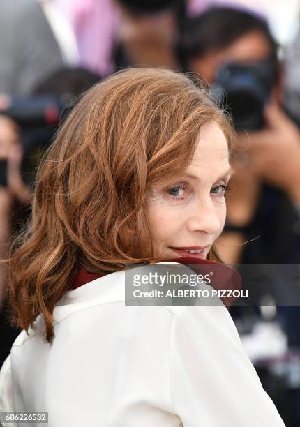French actress Isabelle Huppert poses on May 21, 2017 during a photocall for the film 'Claire's Camera ' at the 70th edition of the Cannes Film...
