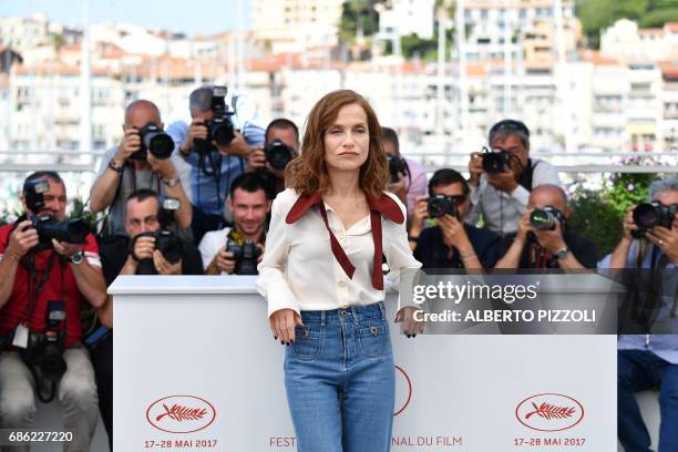 French actress Isabelle Huppert poses on May 21, 2017 during a photocall for the film 'Claire's Camera ' at the 70th edition of the Cannes Film...