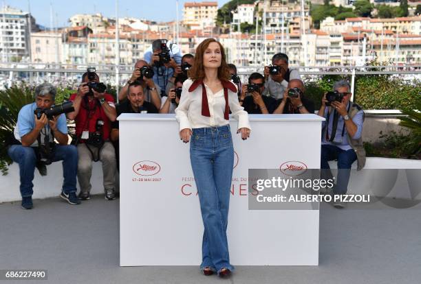 French actress Isabelle Huppert poses on May 21, 2017 during a photocall for the film 'Claire's Camera ' at the 70th edition of the Cannes Film...