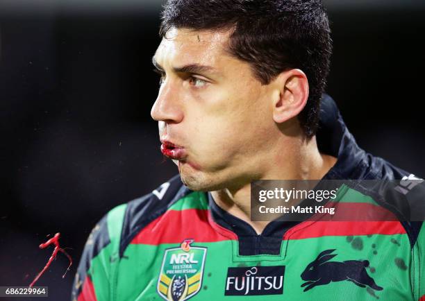 Kyle Turner of the Rabbitohs spits blood during the round 11 NRL match between the South Sydney Rabbitohs and the Melbourne Storm at nib Stadium on...